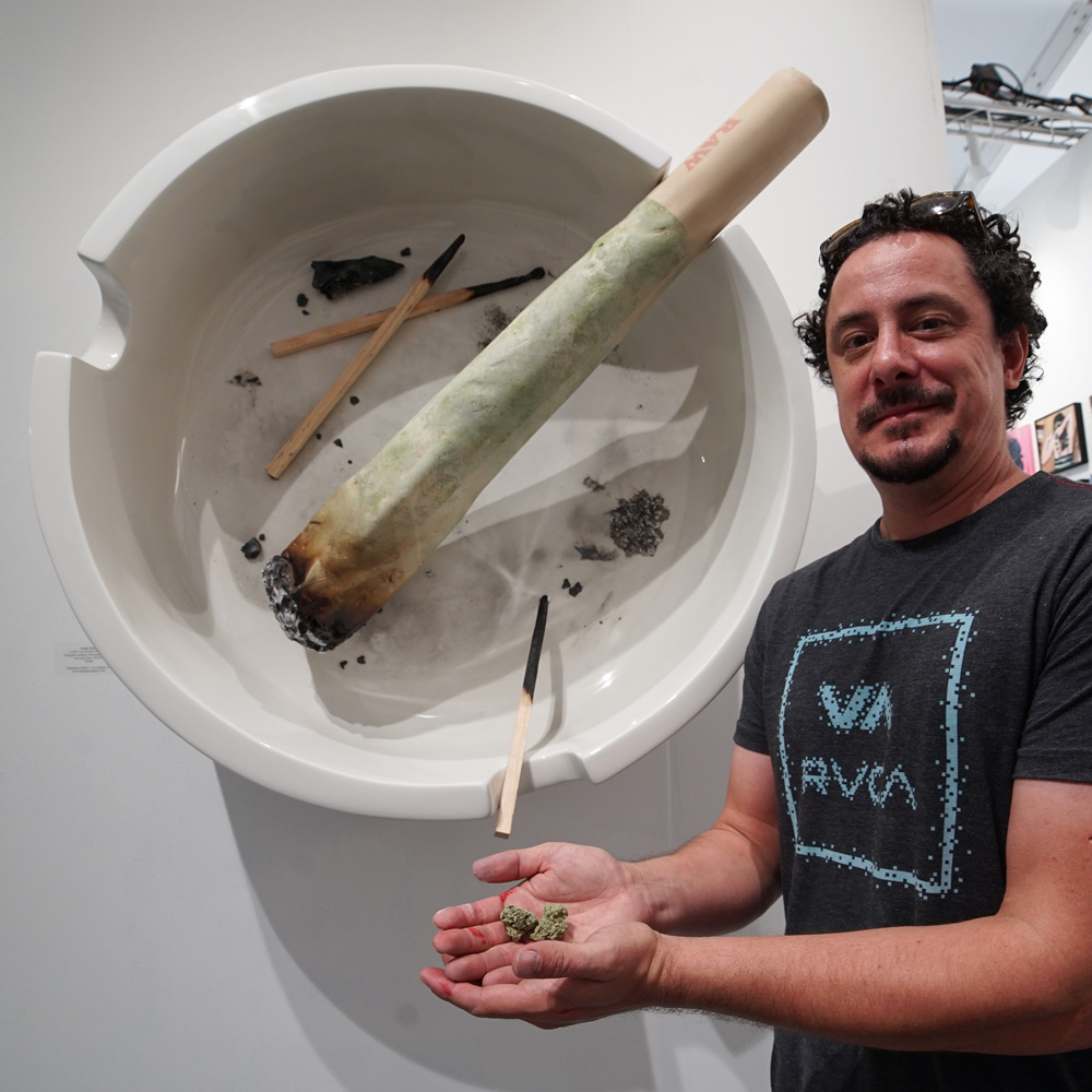 Sergio Garcia with his sculpture for Thinkspace Gallery's Scope booth.